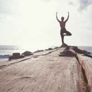 Yoga pose on a pier